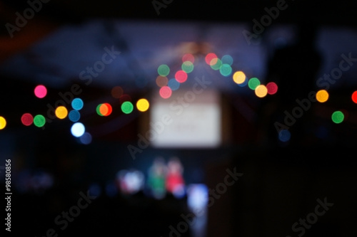 Blur colorful christmas lights bokeh on party background