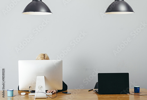 young woman working in a homely office 