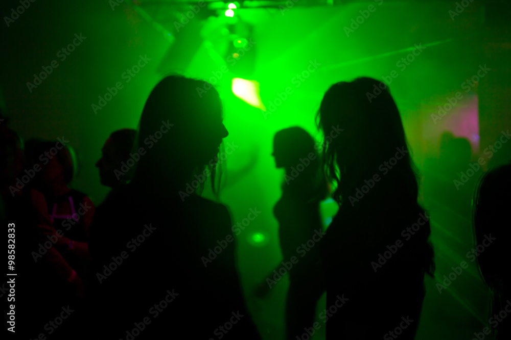 Two womens dancing at the night club