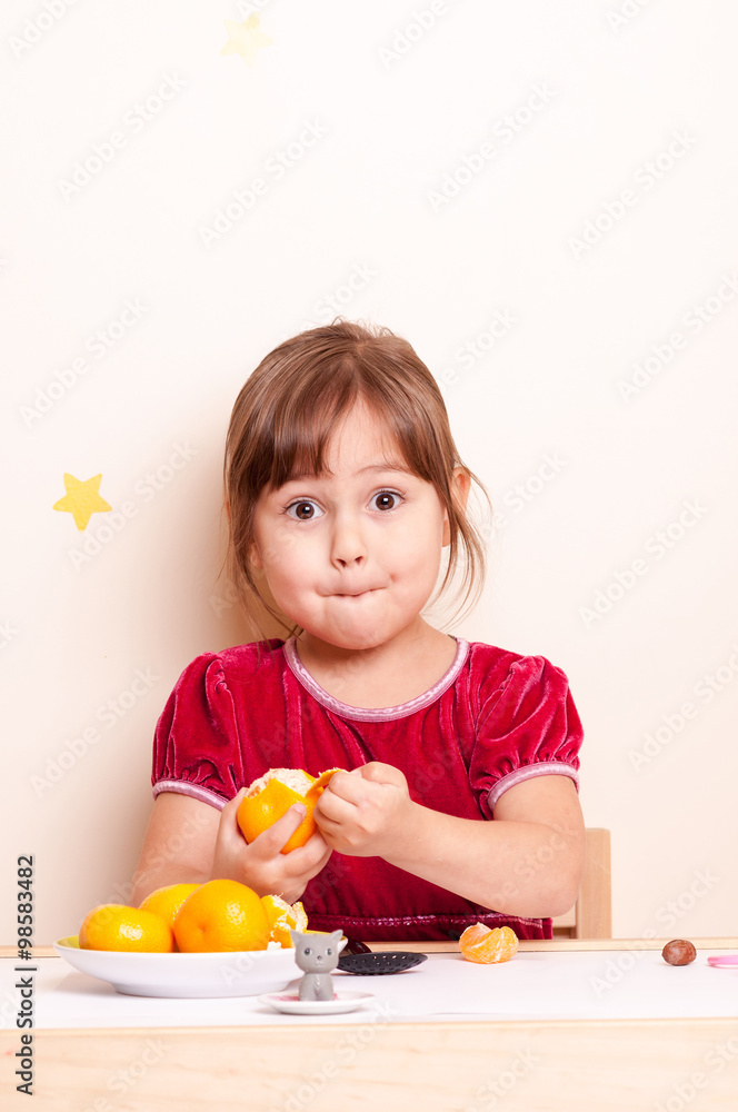surprised little girl eating citrus surprised little girl eating citrus