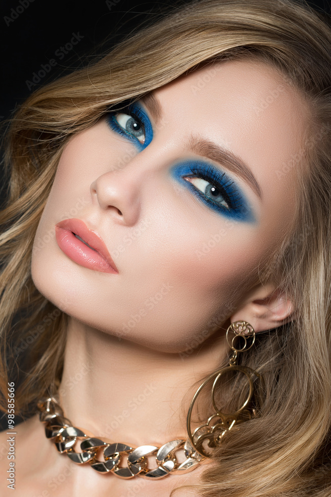 Portrait of young pretty blonde woman with fashion makeup
