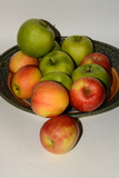 Granny Smith and Fuji apples on ceramic handcrafted platter