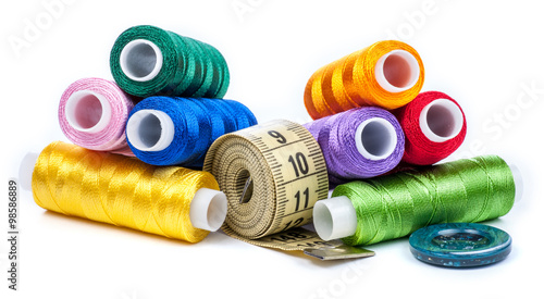 Composition with tailor threads isolated on white background