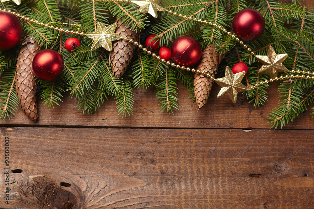 Christmas tree branch, stars, cones, balls on the background of Christmas tree branch, stars, cones, balls on the background of