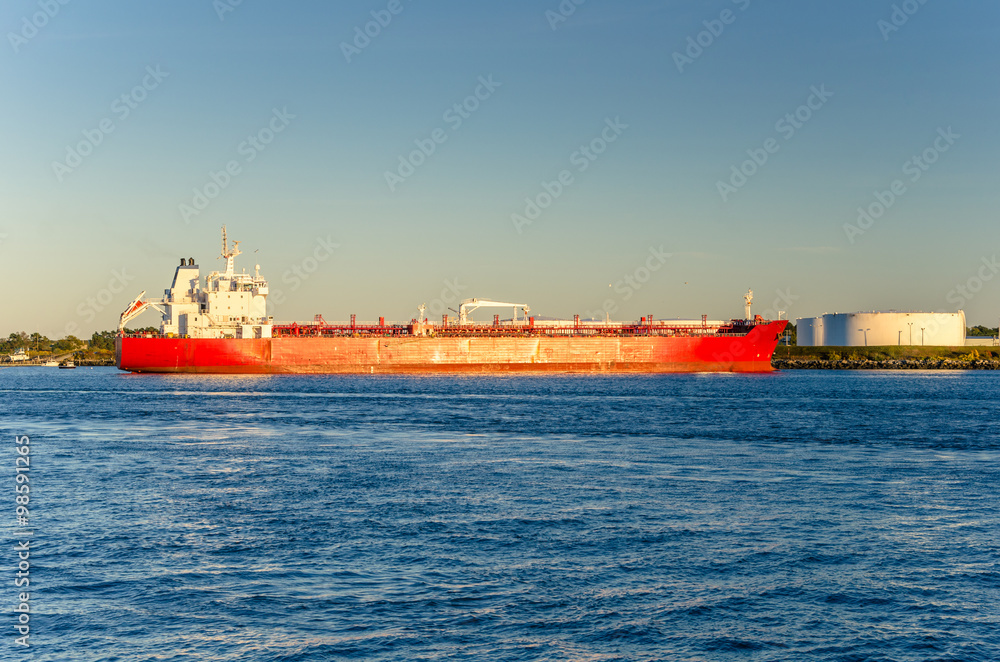 Tanker Ship Moored in Harbour at Sunset. 