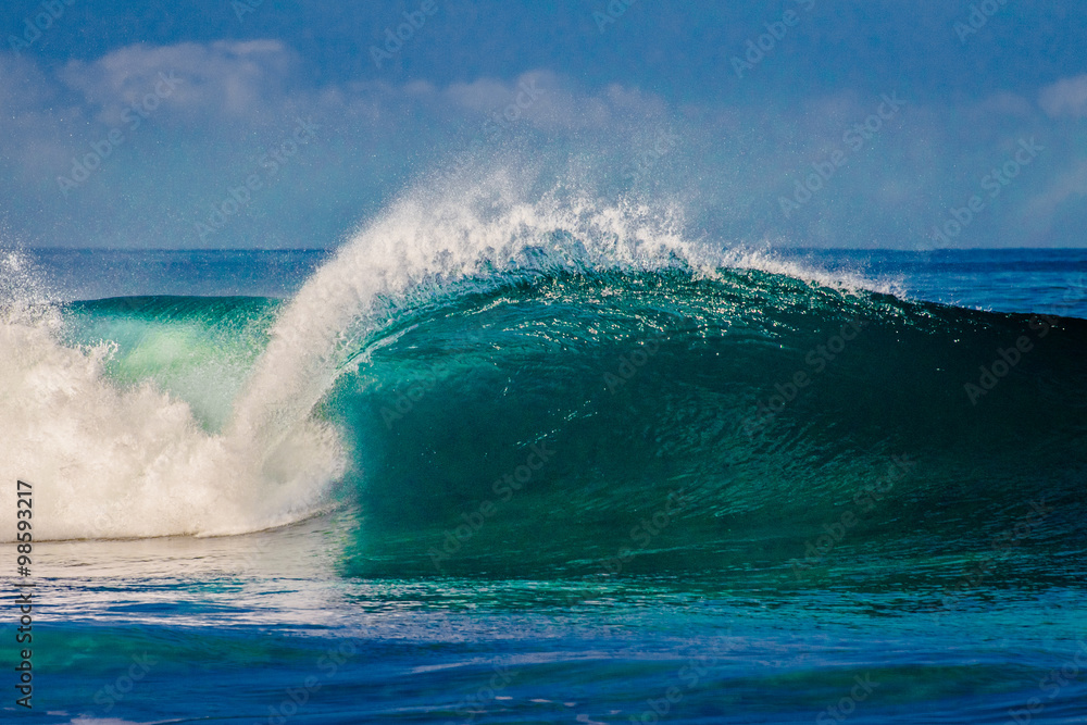 Surfing waves at Bonzai Pipeline on the North Shore of Oahu, Hawaii Surfing waves at Bonzai Pipeline on the North Shore of Oahu, Hawaii
