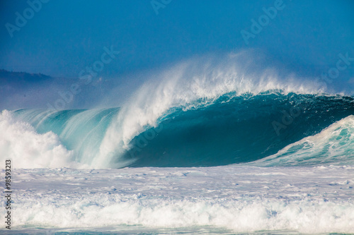 Surfing waves at Bonzai Pipeline on the North Shore of Oahu, Hawaii