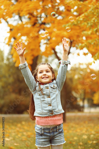 Cute girl playing with soap...