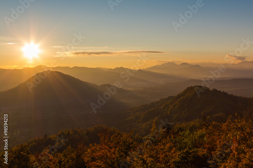 Beautiful cloudless sunset over the middle mountains of Slovenia.