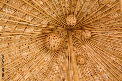 Bamboo shingle roof with woven bamboo hanging folk art