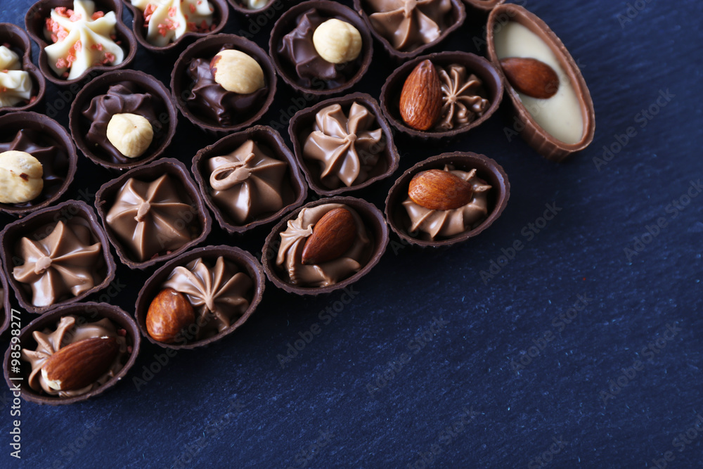 Chocolate sweets on wooden background Chocolate sweets on wooden background