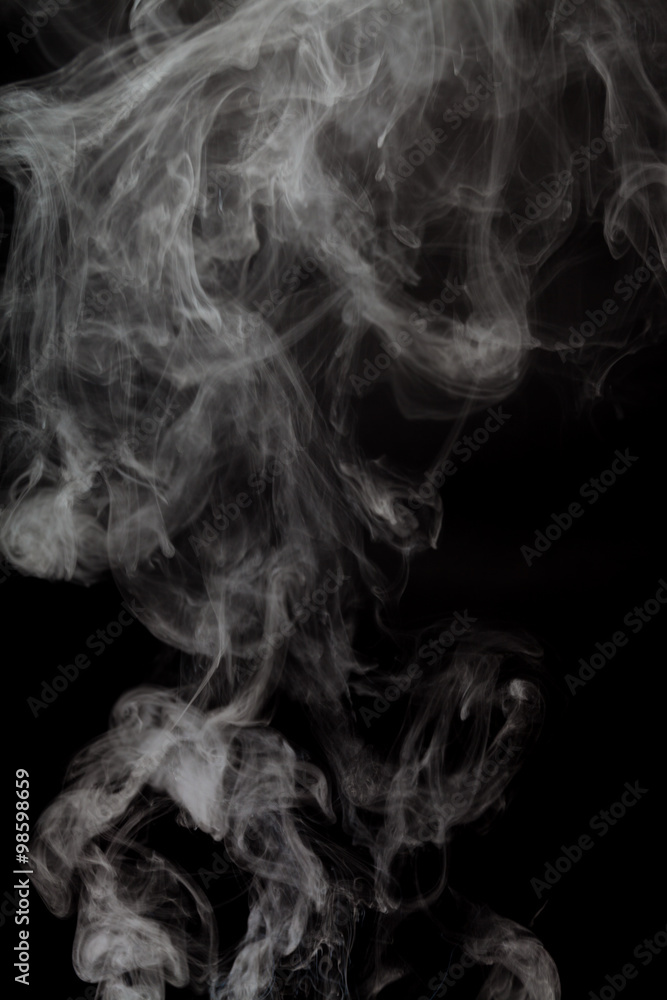Abstract Smoke from electronic cigarette over a black color background Abstract Smoke from electronic cigarette over a black color background