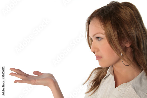 Girl looks at palm isolated on white background