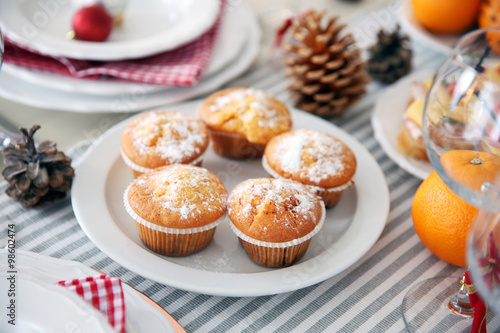 Tasty muffins in a Christmas dinner table