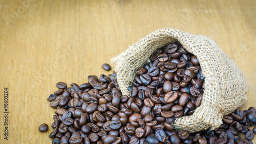 Coffee bean in hemp sack on wooden, selective focus © supitstockphoto