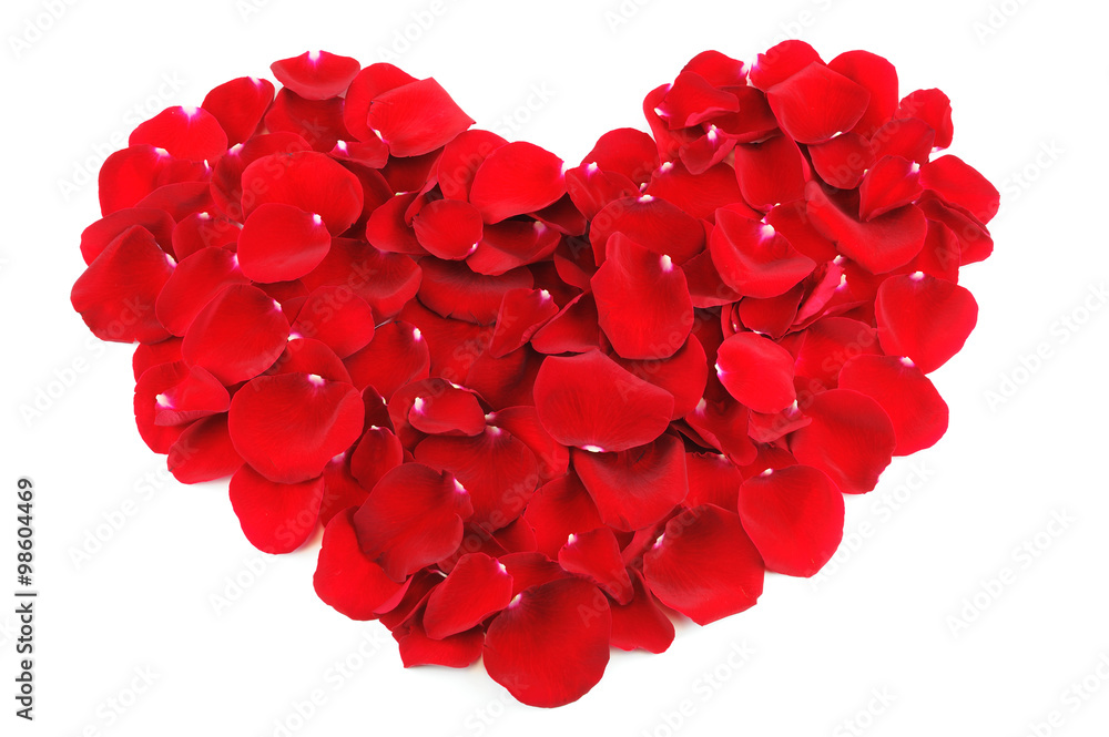 red heart by rose petals on white background red heart by rose petals on white background