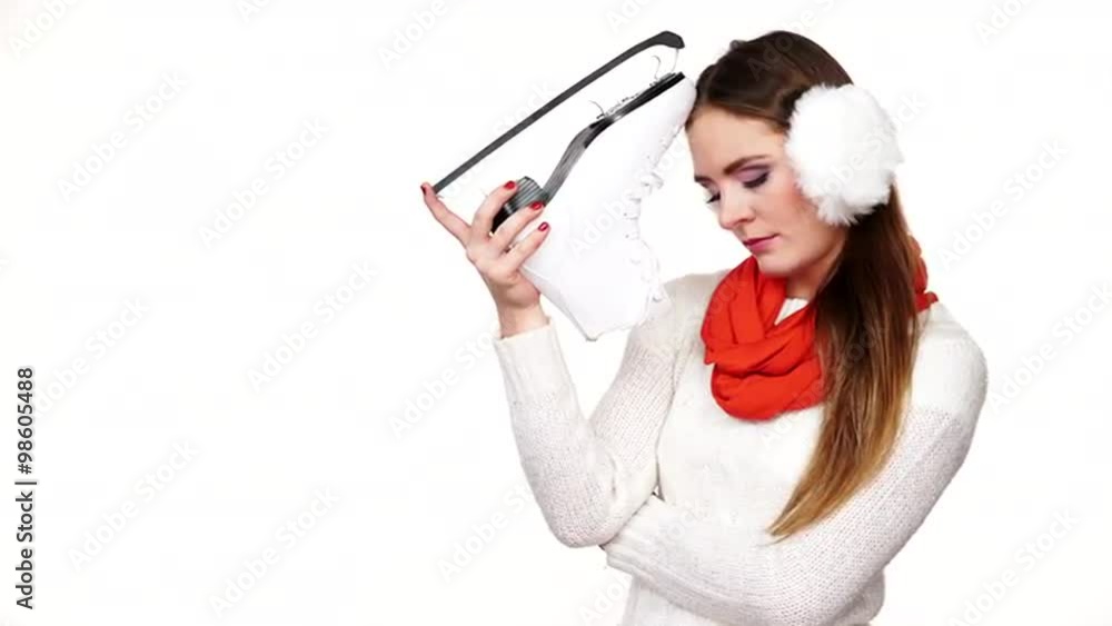 Woman dreaming about ice skating holds skate shoe 4K Woman dreaming about ice skating holds skate shoe 4K