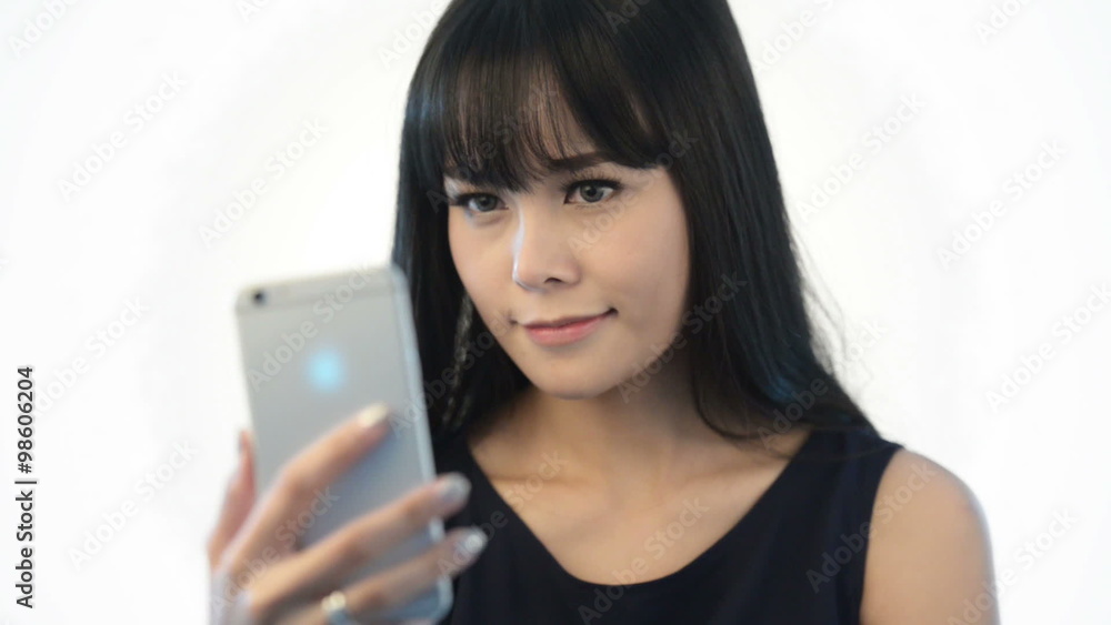 Happy cute woman making selfie over white background. Happy cute woman making selfie over white background.