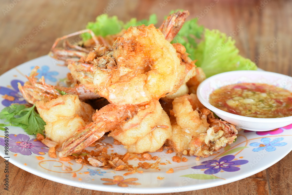 Shrimp with Garlic in dish on wood table Shrimp with Garlic in dish on wood table