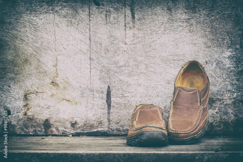 Fashion concept with male shoes on wooden background