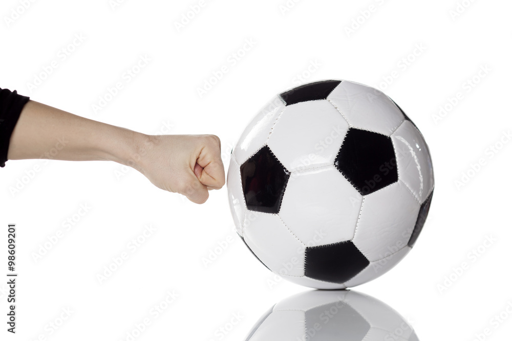 female hand hitting soccer ball with the fist female hand hitting soccer ball with the fist