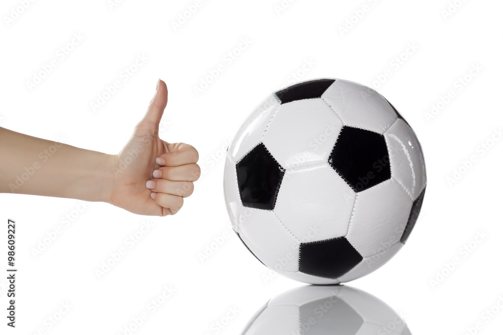 soccer ball and female hand with thumb up soccer ball and female hand with thumb up