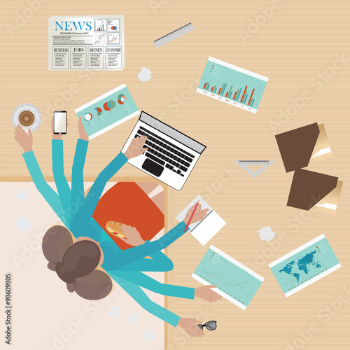 Busy businesswoman working hard on his desk.