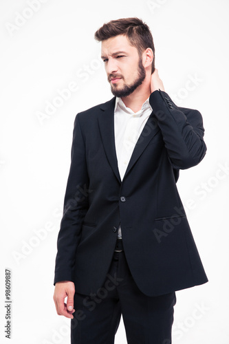 Young businessman having neck pain