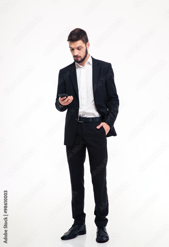 Attractive confident bearded businessman using mobile phone Attractive confident bearded businessman using mobile phone