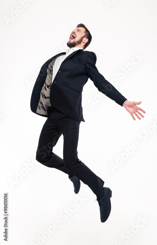 Excited elated happy young business man jumping and shouting