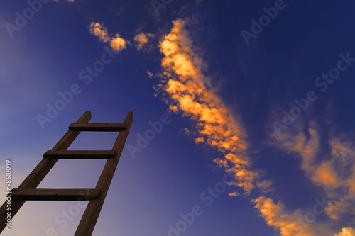 Wooden ladder in sky