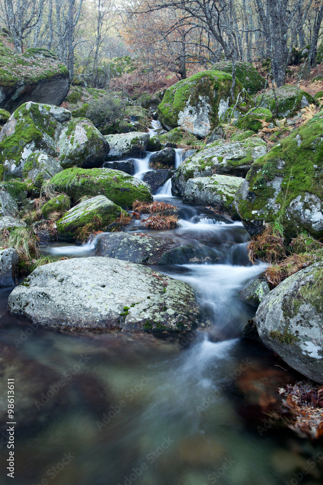 Beautiful river and big rocks with moss Beautiful river and big rocks with moss