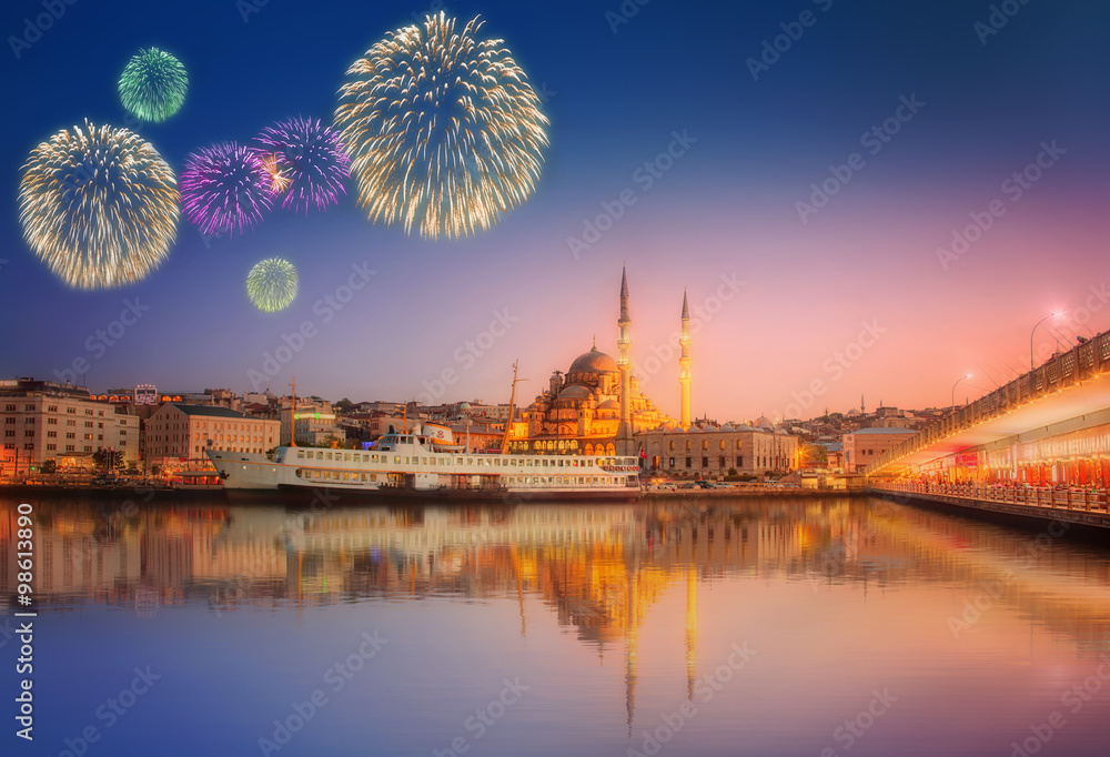 Fototapeta premium Panorama of Istanbul at a dramatic sunset with fireworks