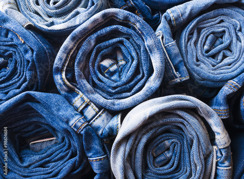 background of a stack rolled jeans