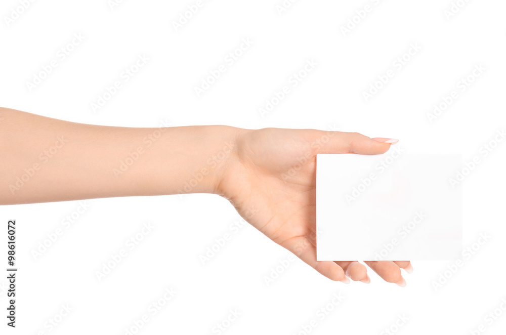 Branding and advertising theme: beautiful female hand holding a blank white paper card isolated on white background Branding and advertising theme: beautiful female hand holding a blank white paper card isolated on white background