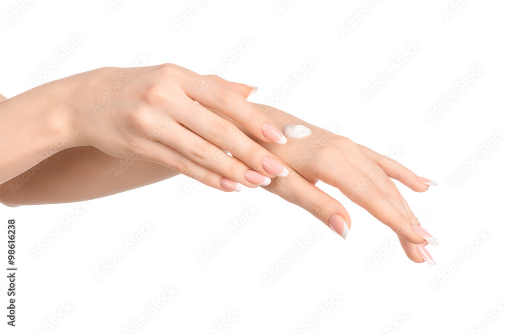Health and body care theme: beautiful female hand with white cream isolated on a white background, hand massage