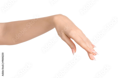 Beauty and Health theme  beautiful elegant female hand show gesture on an isolated white background in studio