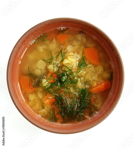 Yellow lentil soup with vegetables and dill