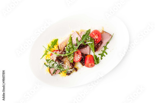 Salad with smoked ham and arugula in the white background horizontal