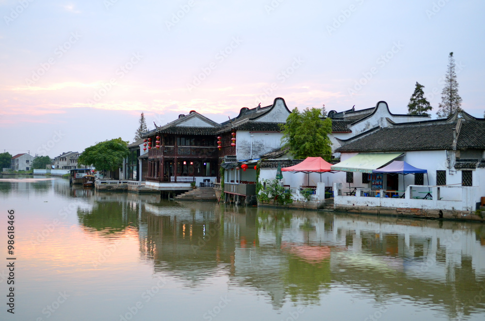 Old village by river in Shanghai with boat.. Old village by river in Shanghai with boat..