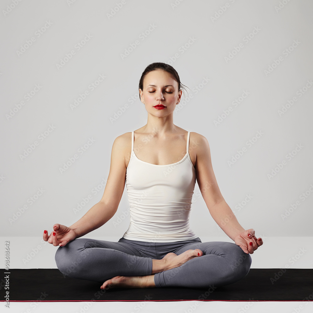 Fototapeta premium young woman doing yoga exercises.healthy sport girl