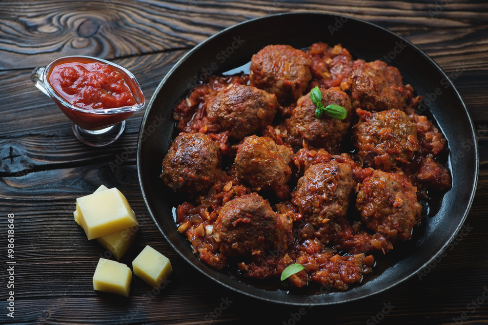 Meatballs with tomato sauce and parmesan cheese, studio shot Meatballs with tomato sauce and parmesan cheese, studio shot