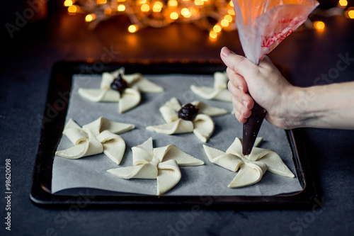Joulutorttu, traditional finnish christmas pastry. Dark photo. selective focus