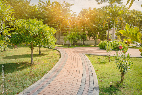 Brick block jogging track in the garden with sunlight