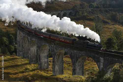 Steam locomotive on railway road bridge