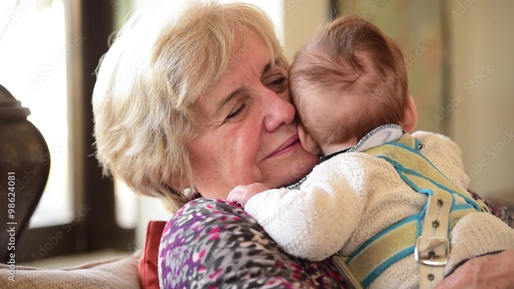 Grand Mother with her grand son, playing and giving him love. Grand Mother with her grand son, playing and giving him love.