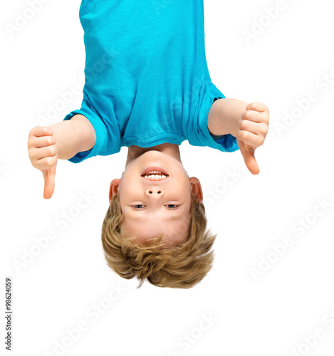 Obraz na płótnie Handsome little boy hanging upside down
