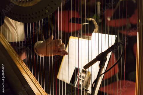 Фотография Part of musical instrument called harp in abstract background