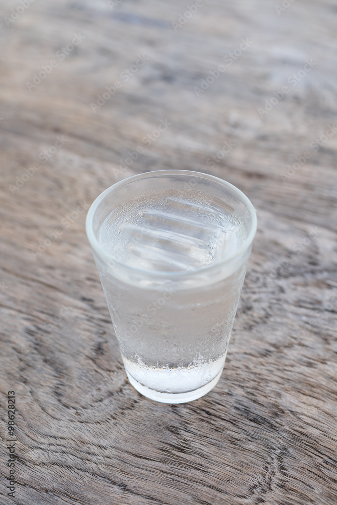 cold drinking water on wooden background cold drinking water on wooden background