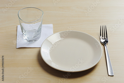 empty plate on wood table